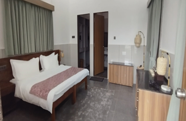 Cozy 15×14 ft Villa villa offers a simple yet comfortable space within the ashram. Spanning 210 sq. ft., it provides an atmosphere of peace and balance, ideal for rest and contemplation.